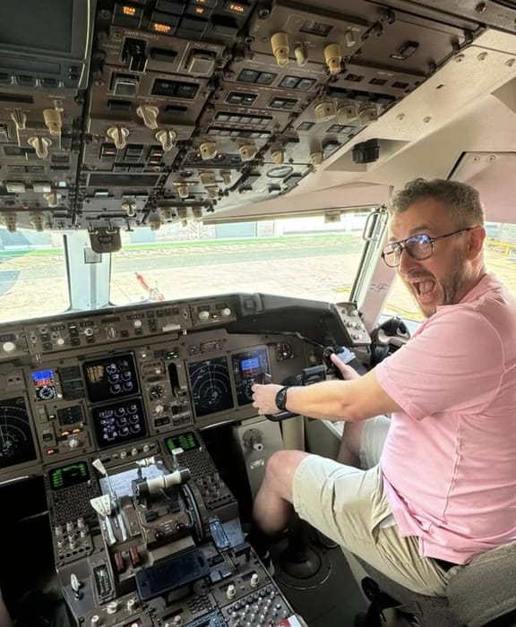 Adrian Hancock in an aircraft cockpit